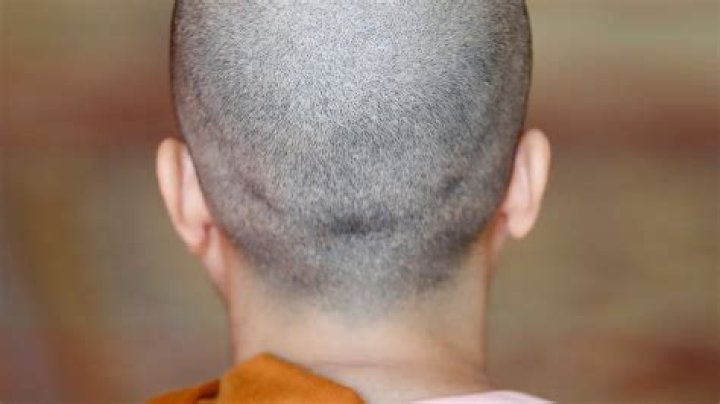 Why does Joe Satriani shave his head?
